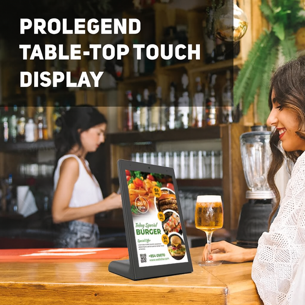Table-top touch display in a restaurant setting with a woman ordering a burger.